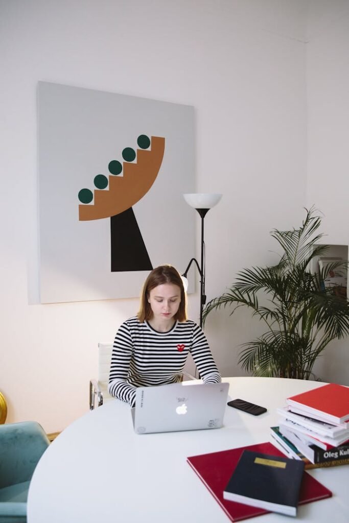 Photo Of Woman Sitting Near Indoor Plant